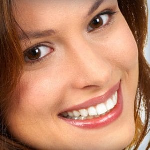 A woman smiling
