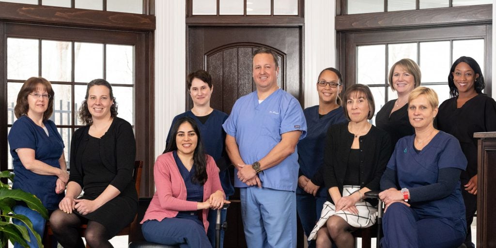 Group photo of Endodontist Dr. Philip Mascia and his Office Staff at The Greater Danbury Center for Endodontics